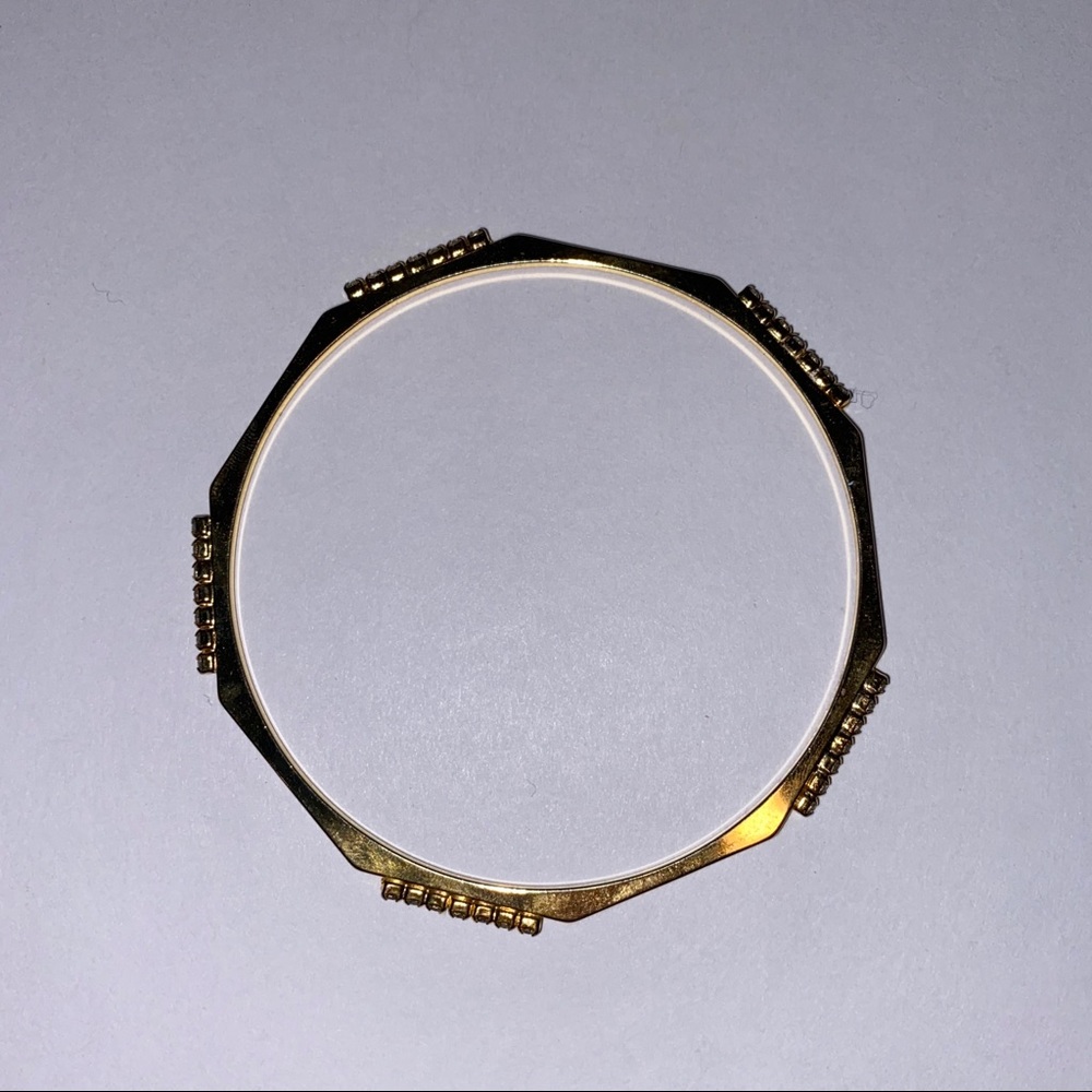 Gold tone studded bangle bracelet